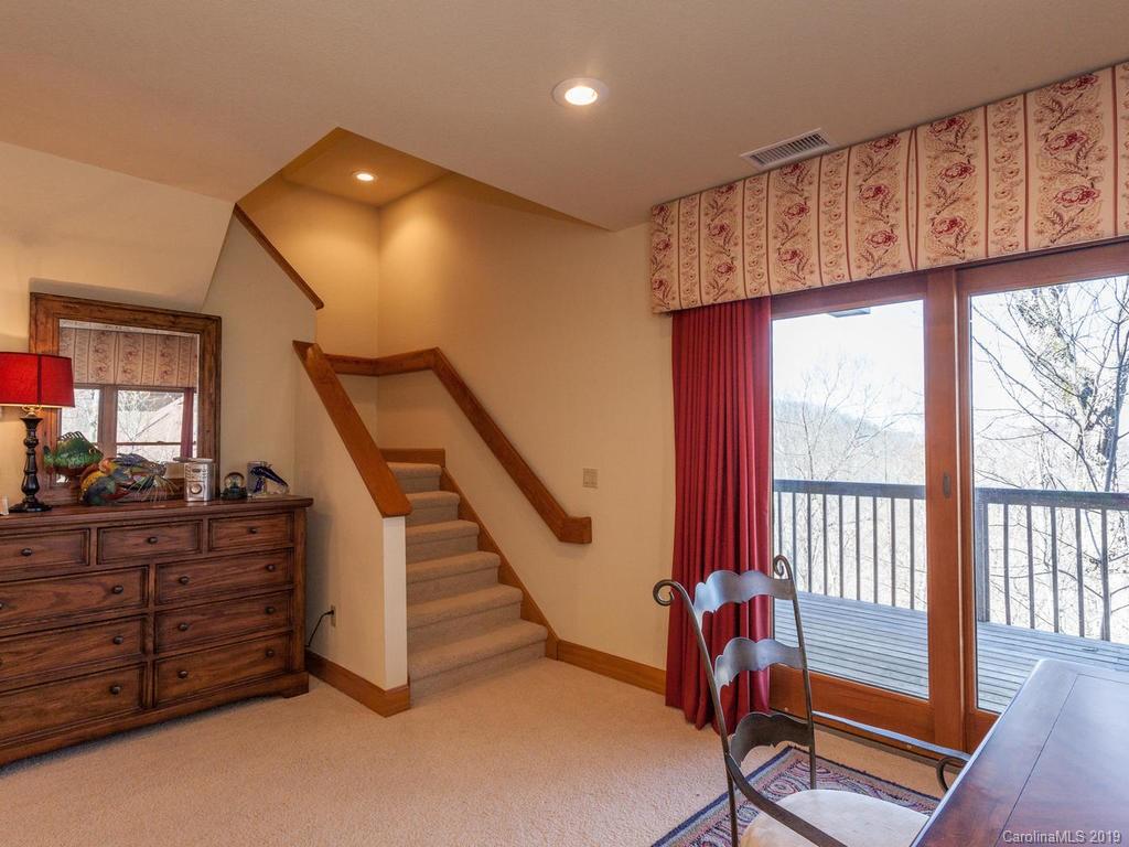 755 Andrew Banks Road Burnsville, NC 28714 - Photo 21 of 24 a view of a hallway with staircase