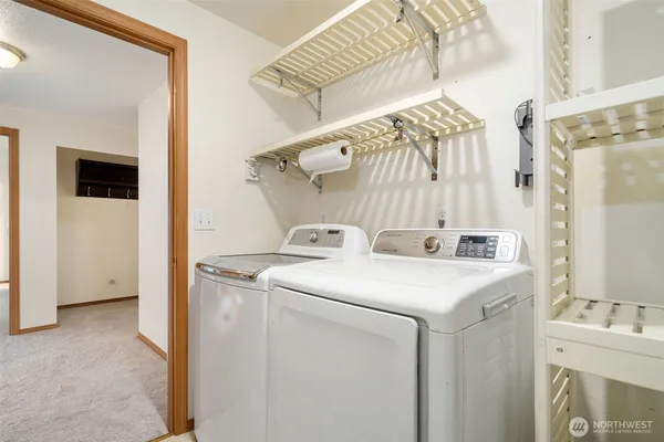 a utility room with dryer and washer