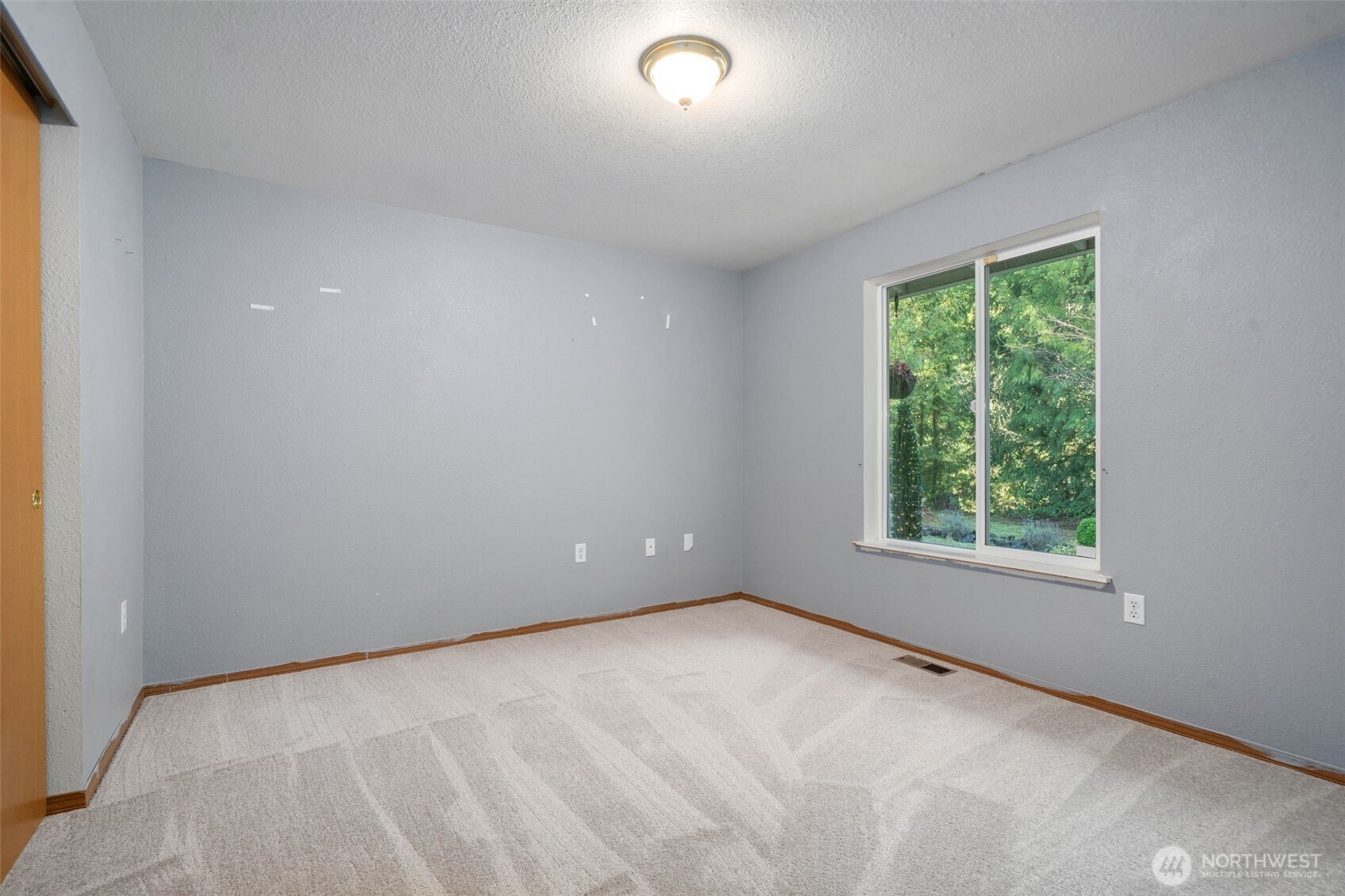 297 Lewis Road West Seabeck, WA 98380 - Photo 21 of 35 an empty room with a window