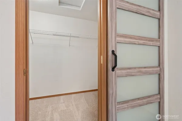 a view of a garage with wooden table and chairs