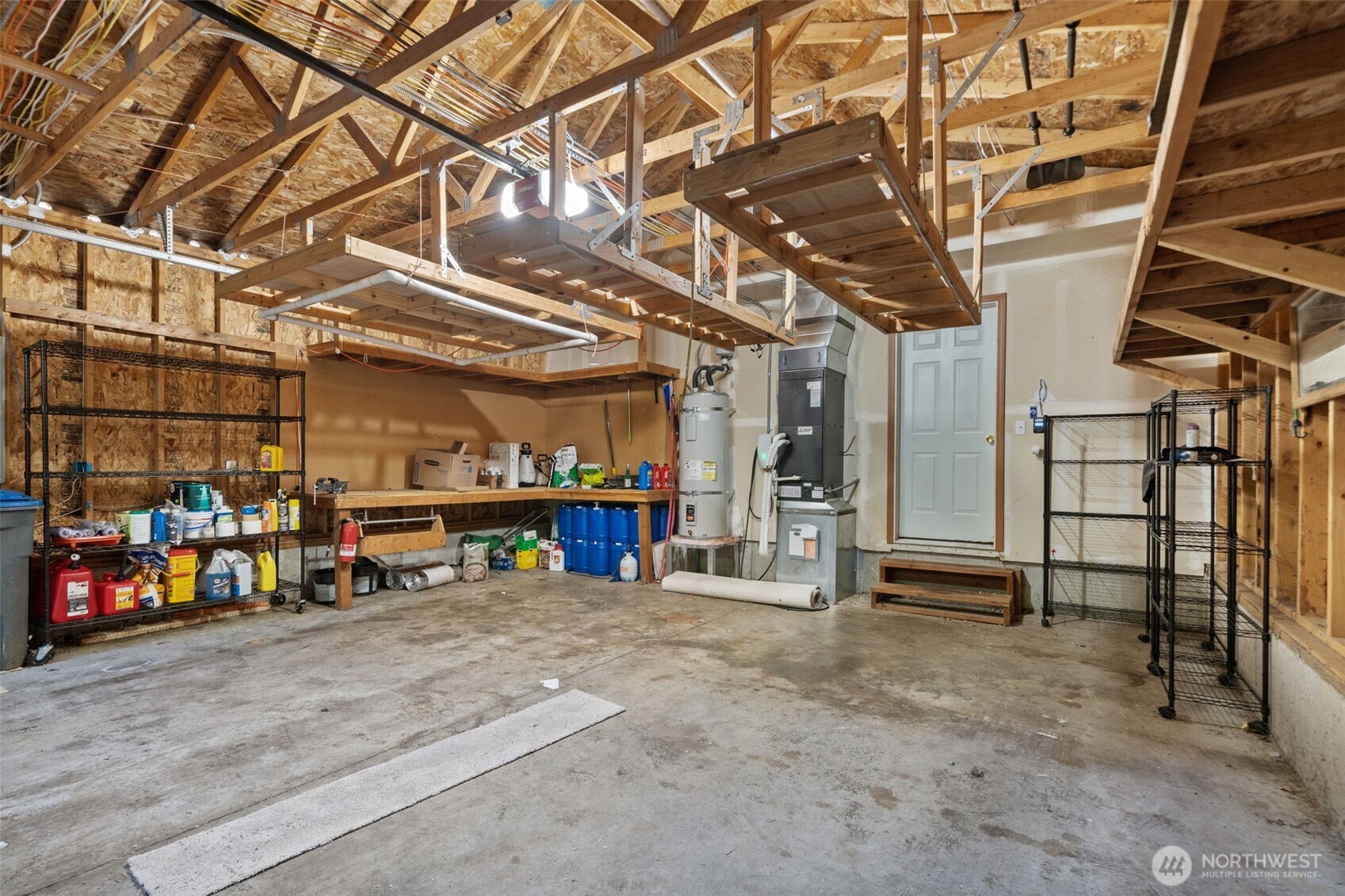 297 Lewis Road West Seabeck, WA 98380 - Photo 27 of 35 a view of a garage with wooden table and chairs