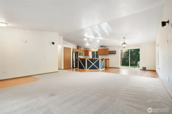 a view of a livingroom with furniture and a window