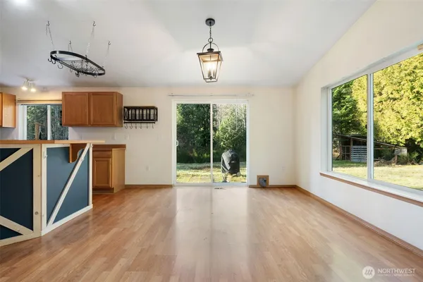 a view of a kitchen with a large window