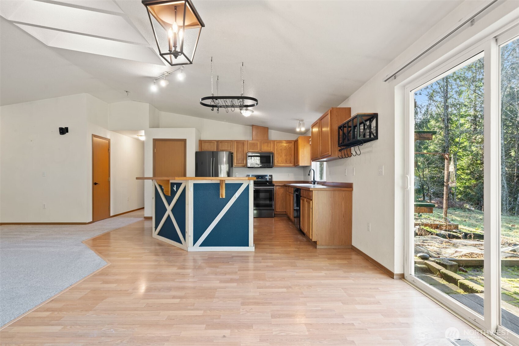 297 Lewis Road West Seabeck, WA 98380 - Photo 10 of 35 a view of a kitchen with furniture and wooden floor