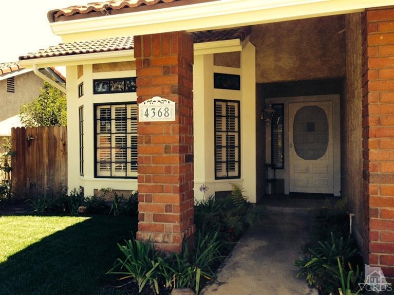 4368 Laurelhurst Road Moorpark, CA 93021 - Photo 2 of 28 a front view of a house with a yard
