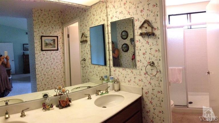 4368 Laurelhurst Road Moorpark, CA 93021 - Photo 15 of 28 a bathroom with a sink and a mirror