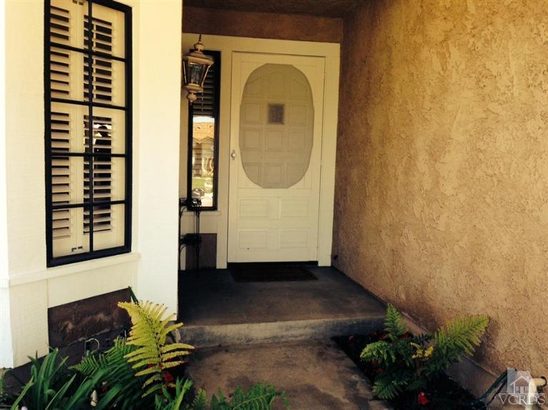 4368 Laurelhurst Road Moorpark, CA 93021 - Photo 3 of 28 a front view of a house with a yard
