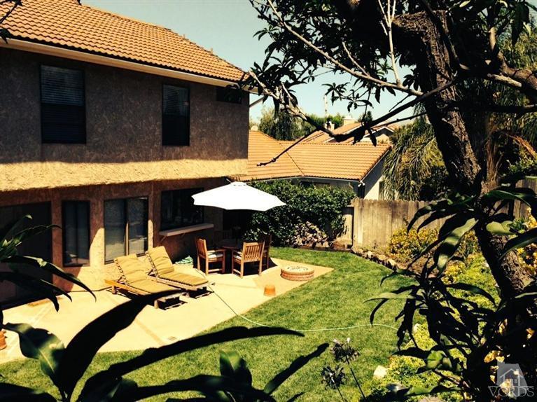 4368 Laurelhurst Road Moorpark, CA 93021 - Photo 23 of 28 a view of a patio with table and chairs under an umbrella
