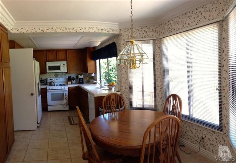 4368 Laurelhurst Road Moorpark, CA 93021 - Photo 9 of 28 a kitchen with furniture and a window