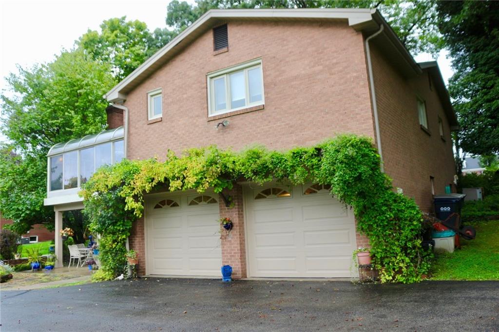 241 McKinney Road Wexford, PA 15090 - Photo 25 of 25 Rear of the home, brick for low maintenance, black top driveway.