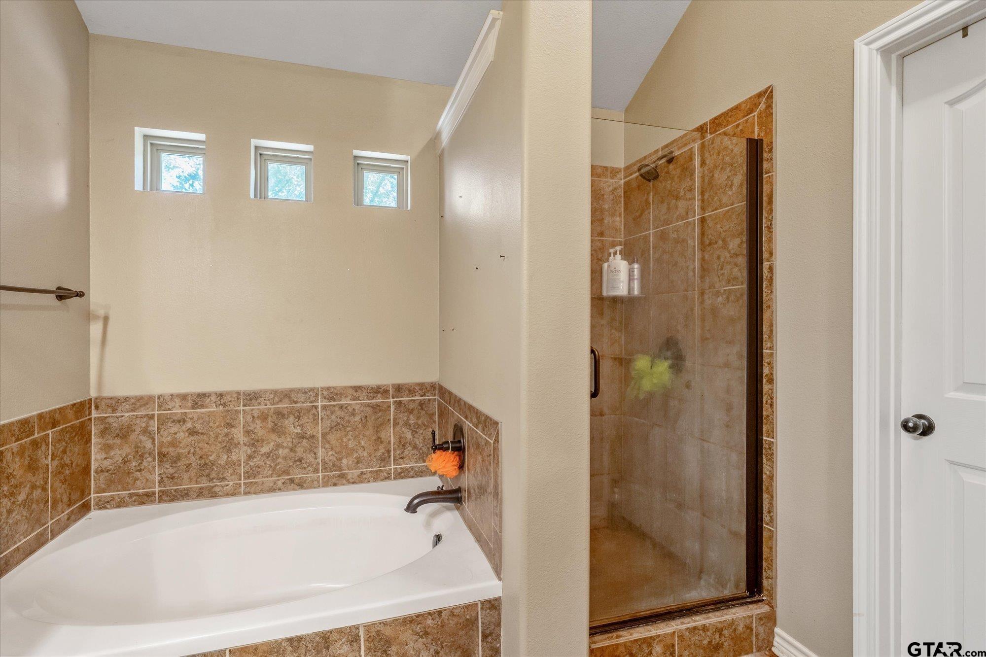 469 Cherokee Street Rusk, TX 75785 - Photo 11 of 35 a bathroom with a bathtub and shower