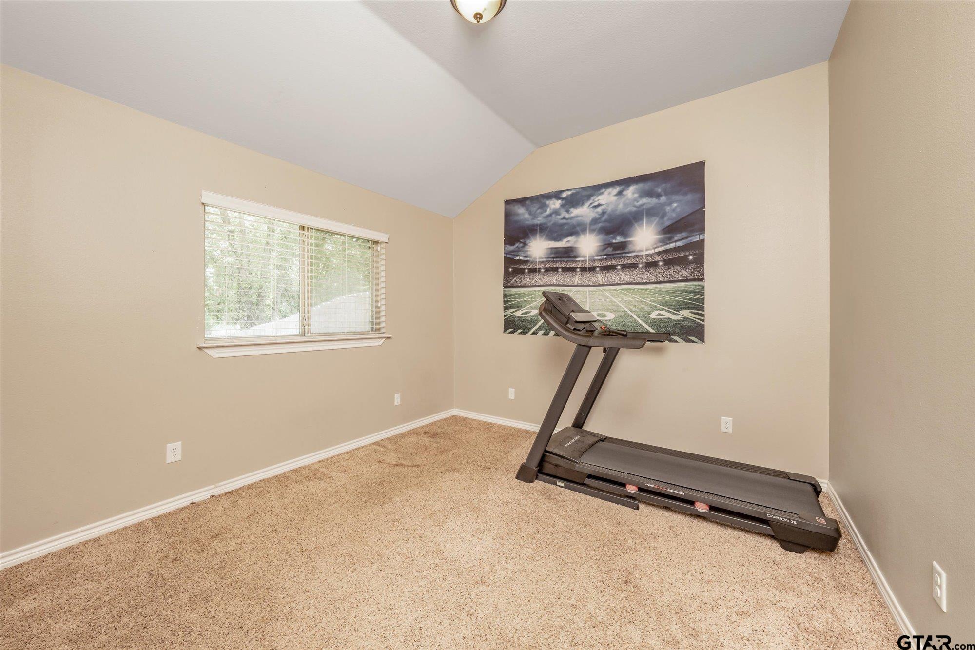 469 Cherokee Street Rusk, TX 75785 - Photo 17 of 35 a room with gym equipment and windows