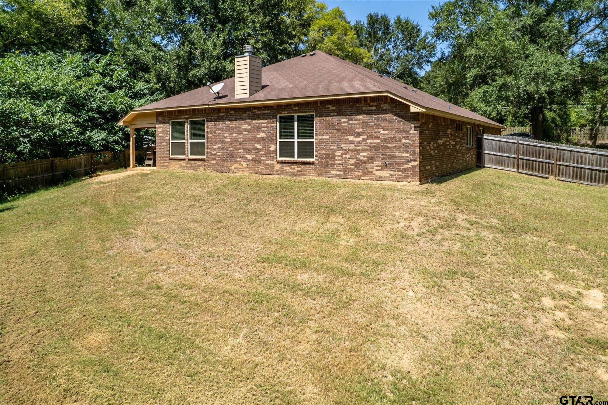 469 Cherokee Street Rusk, TX 75785 - Photo 25 of 35 a front view of a house with a garden