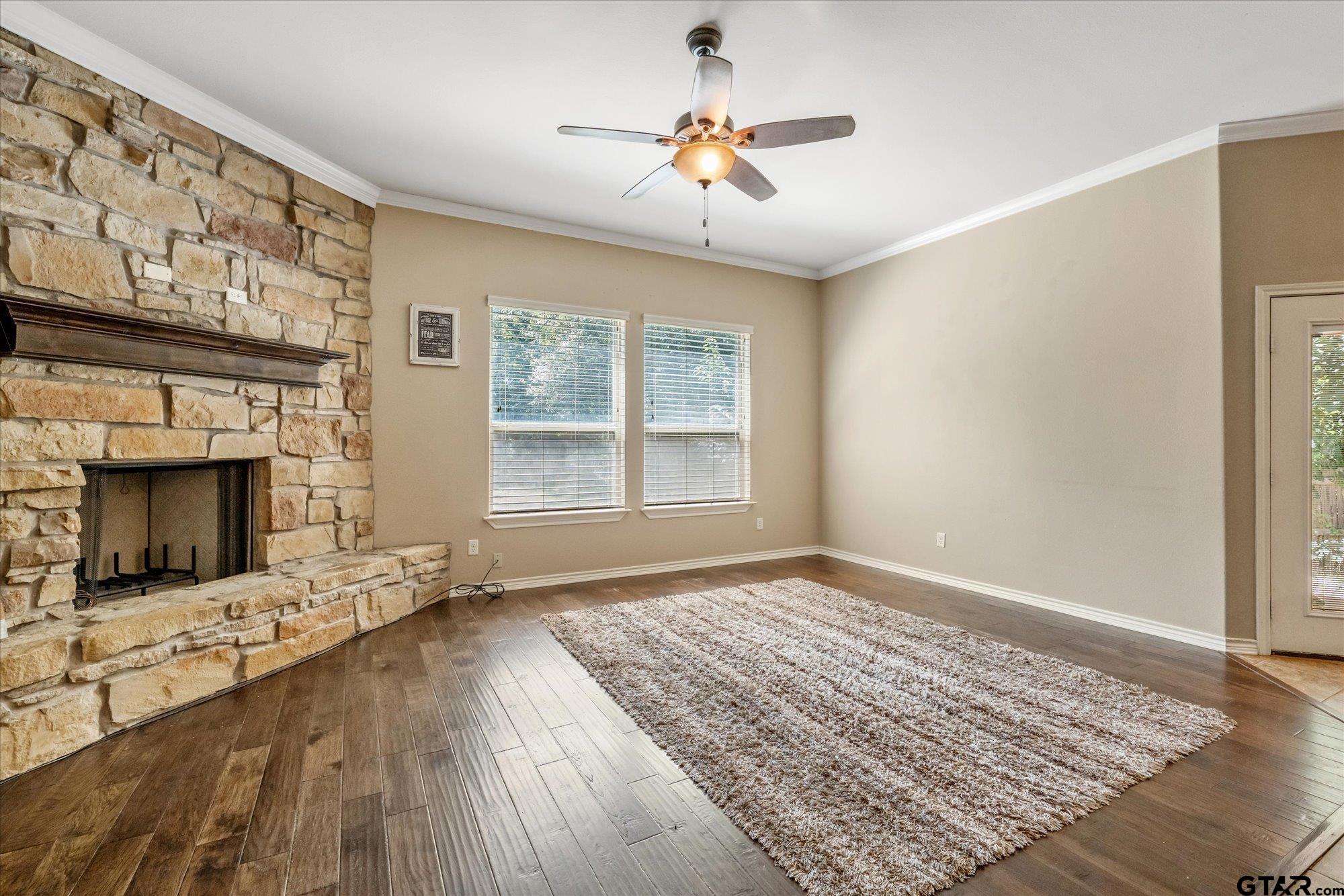469 Cherokee Street Rusk, TX 75785 - Photo 27 of 35 a view of an empty room with a fireplace and a window