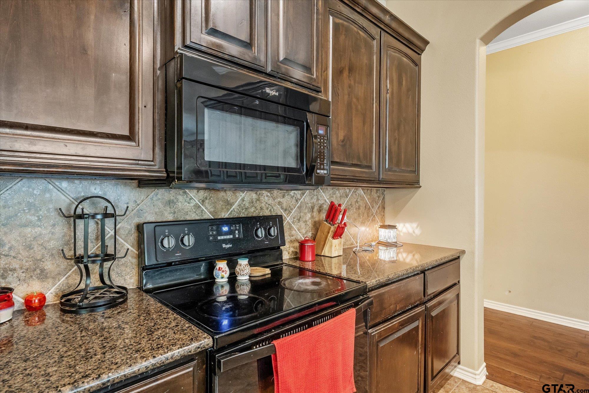469 Cherokee Street Rusk, TX 75785 - Photo 33 of 35 a kitchen with stainless steel appliances granite countertop a sink stove and cabinets