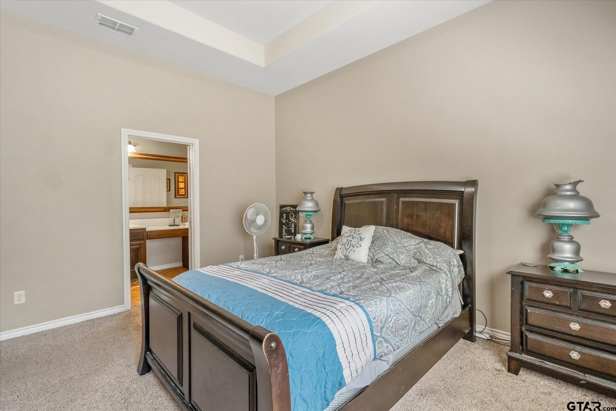 469 Cherokee Street Rusk, TX 75785 - Photo 9 of 35 a bedroom with a bed and a dresser in it