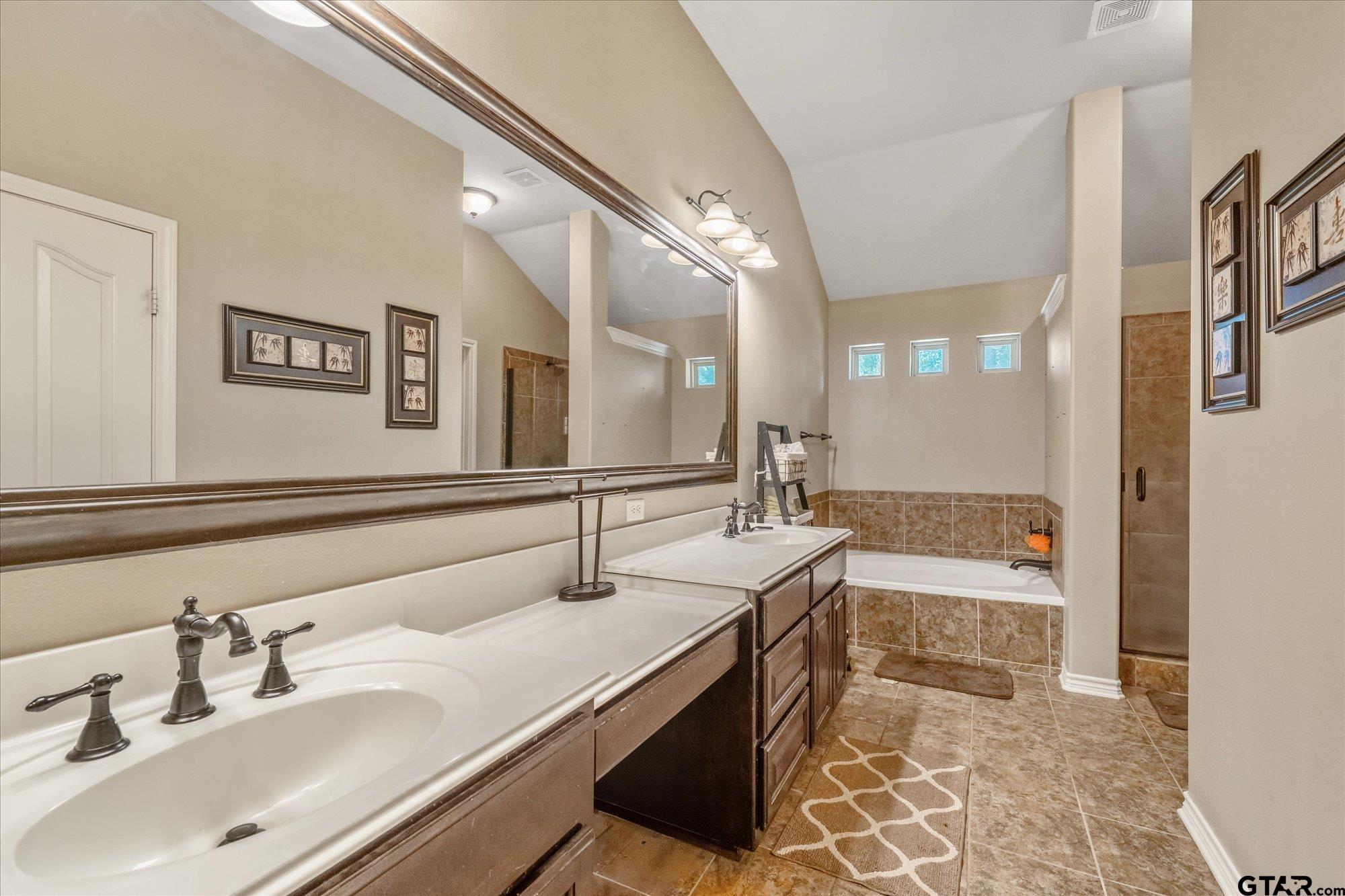 469 Cherokee Street Rusk, TX 75785 - Photo 10 of 35 a bathroom with a tub sink and mirror