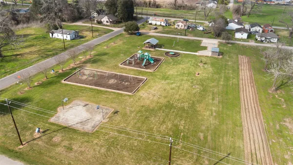 a view of a swimming pool with a yard