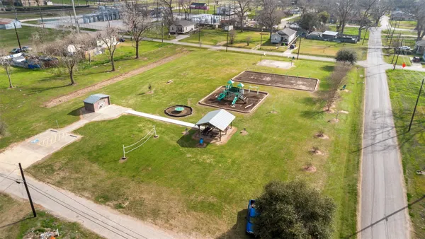 a front view of a house with a garden and plants