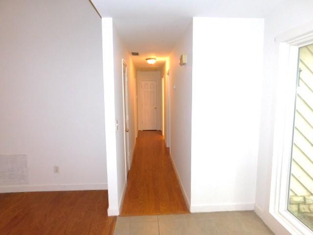 1710 Pine Road Marietta, GA 30062 - Photo 12 of 23 a view of a hallway with wooden floor and a bathroom