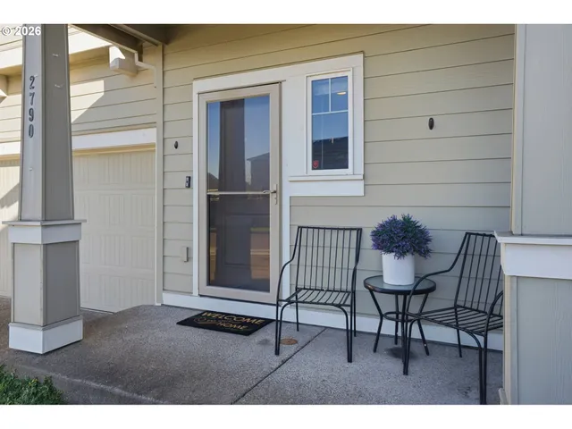 a view of a house with a table and chair