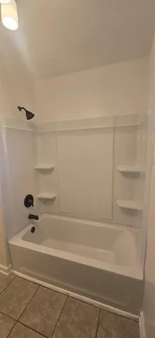 a bathroom with bathtub