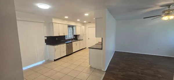 a view of a kitchen with electric appliances