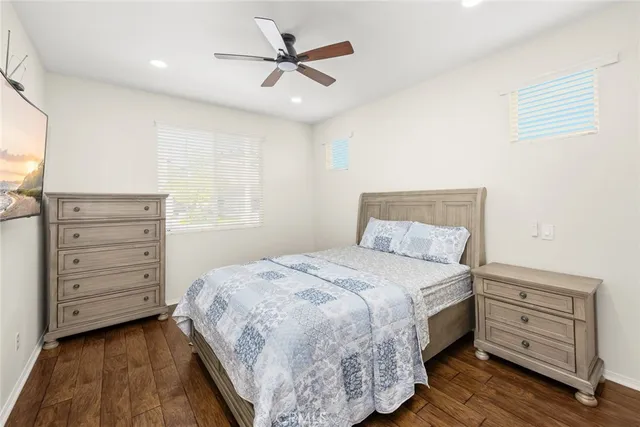 a bedroom with a bed and a dresser