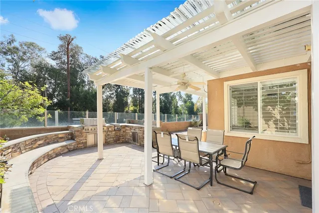 a building outdoor space with patio furniture and garden view
