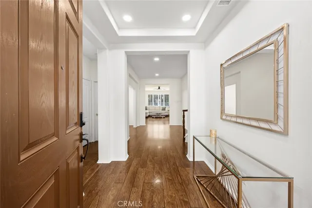 a view of a hallway view with wooden floor and staircase