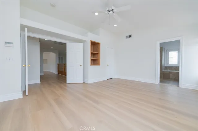 a bathroom with a granite countertop sink mirror and a bathtub