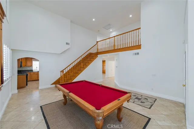 a living room with furniture and air hockey table