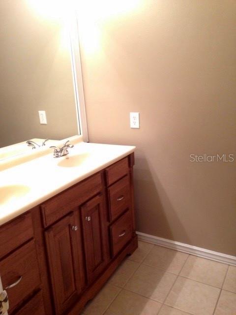 8330 Duval Drive Port Richey, FL 34668 - Photo 11 of 20 a bathroom with a sink vanity and a mirror