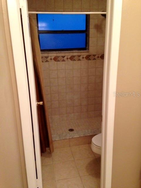 8330 Duval Drive Port Richey, FL 34668 - Photo 12 of 20 a bathroom with a toilet and a shower