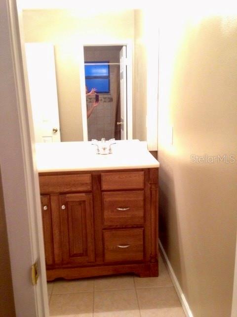8330 Duval Drive Port Richey, FL 34668 - Photo 13 of 20 a bathroom with a sink and a mirror