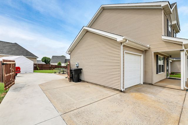a living room with furniture rug and window