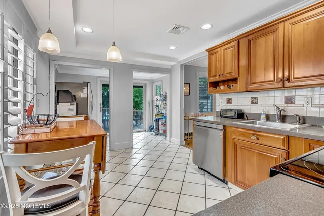 a kitchen with stainless steel appliances granite countertop a sink and cabinets