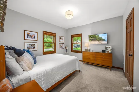 a bed room with a bed and a window