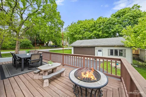 a balcony with furniture and wooden floor