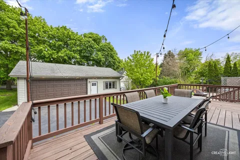 a view of a house with a yard and sitting area