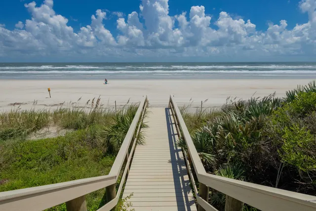 a view of a balcony with wooden floor