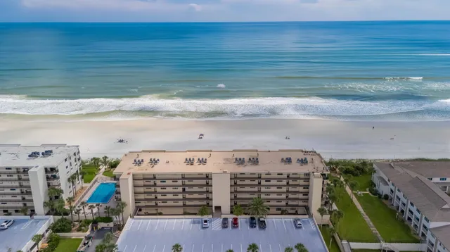 a dining room with furniture wooden floor and windows