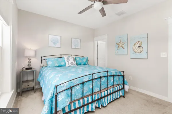 a white toilet sitting next to a shower