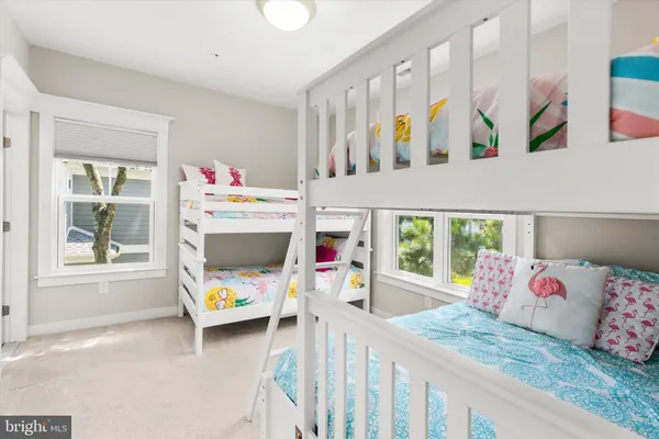 a bathroom with a sink toilet and shower curtain