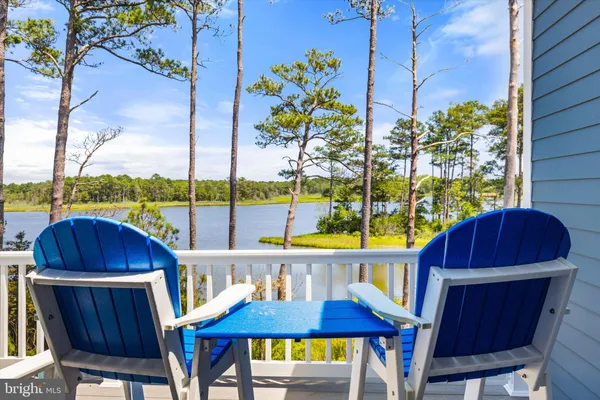 a bedroom with a bed a dresser and a window