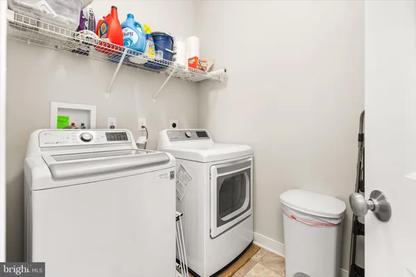 a bedroom with a bed and a flat tv screen on dresser