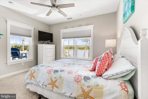 an aerial view of residential houses with outdoor space and swimming pool