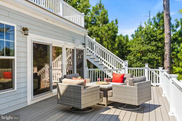an aerial view of residential houses with outdoor space and lake view