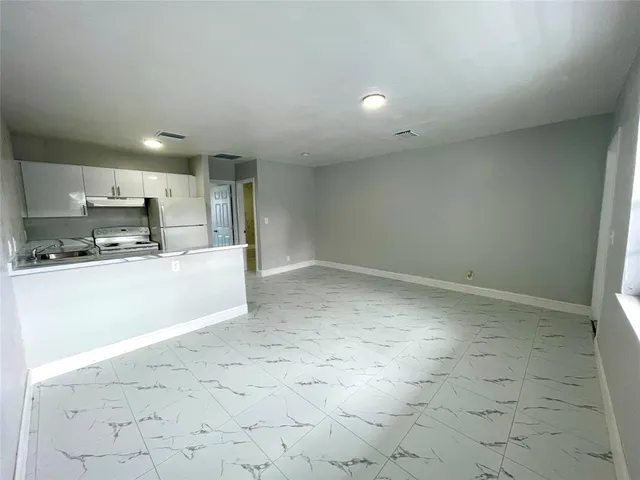 a view of a kitchen with a sink