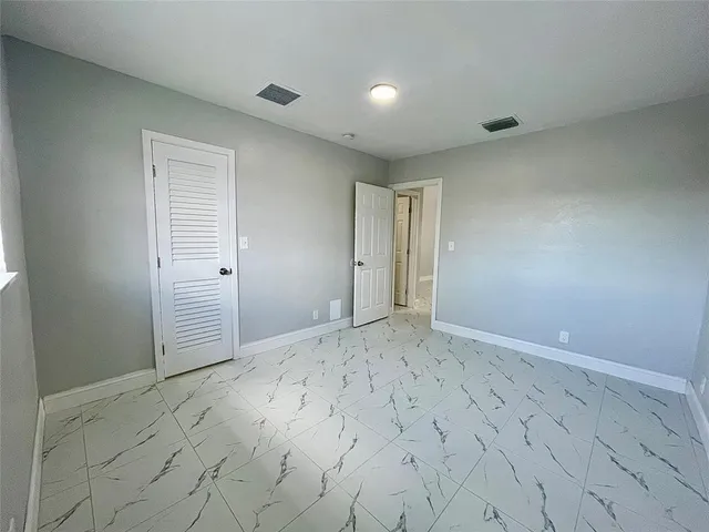 a view of hallway with wooden floor